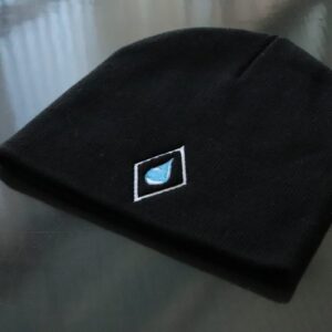 Angled view of a black Arctic Chiller beanie with embroidered logo patch for custom corporate apparel.