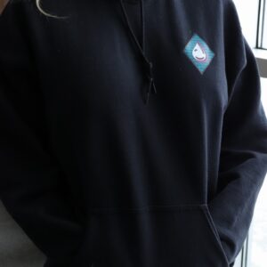 Person wearing a black hoodie with Arctic Chiller logo for branded corporate apparel and promotional use.