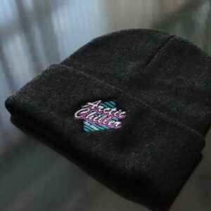 Folded black Arctic Chiller beanie with embroidered retro logo displayed as branded winter promotional apparel.